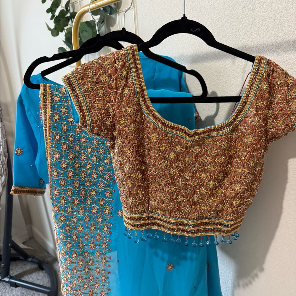 Heavily embellished sari with two blouses